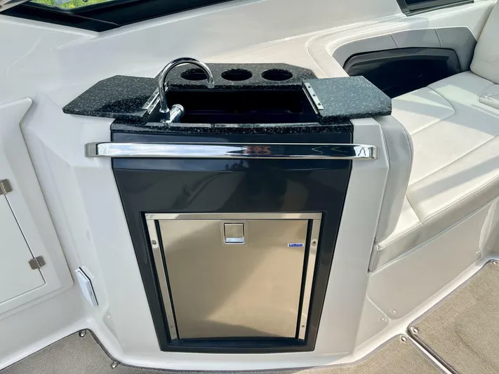 Yacht Photos Pics 2012 Monterey 328 SS boat interior with sink and mini fridge.