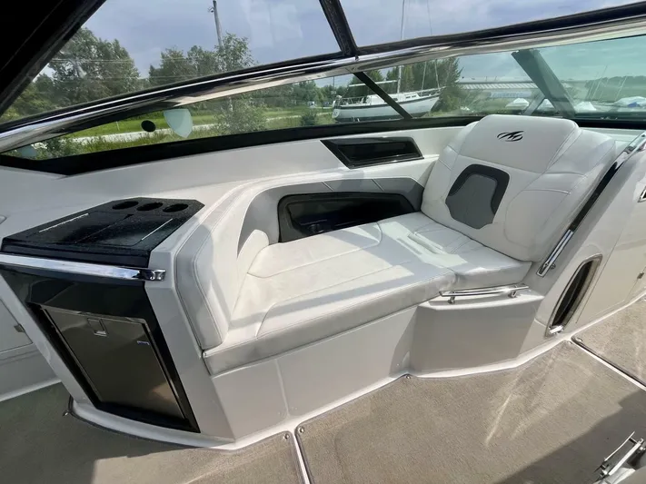  Yacht Photos Pics Interior of a 2012 Monterey 328 SS boat with white seating and sleek design.