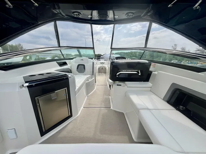  Yacht Photos Pics Interior of a 2012 Monterey 328 SS boat with modern seating and sleek design.