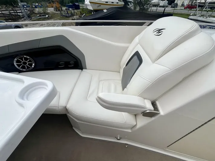  Yacht Photos Pics Luxurious white seating on a 2012 Monterey 328 SS boat, featuring sleek design and comfort.