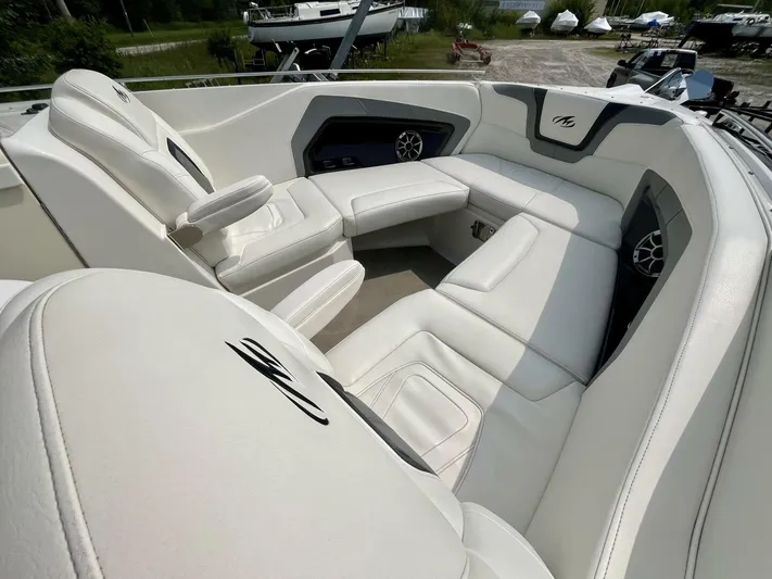  Yacht Photos Pics Luxurious white seating in a 2012 Monterey 328 SS boat interior.