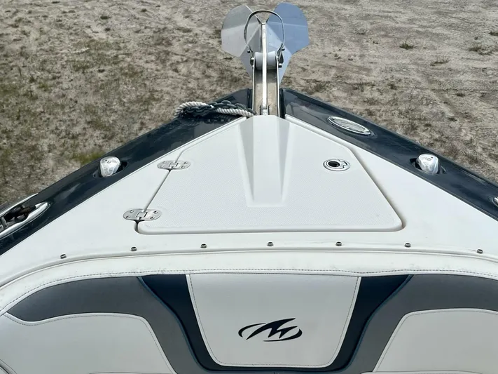  Yacht Photos Pics Bow of 2012 Monterey 328 SS boat with anchor and logo visible.