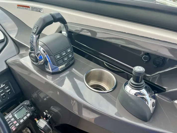  Yacht Photos Pics Control panel of a 2012 Monterey 328 SS boat with joystick and throttle.