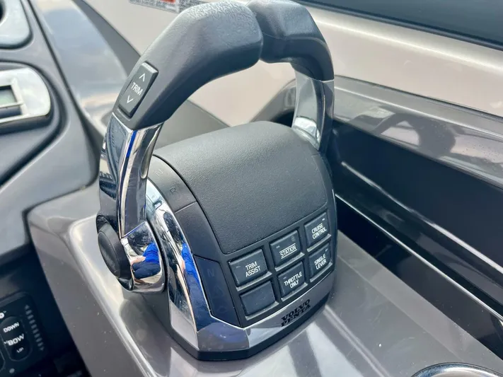  Yacht Photos Pics Throttle control panel of a 2012 Monterey 328 SS boat with buttons and chrome handles.