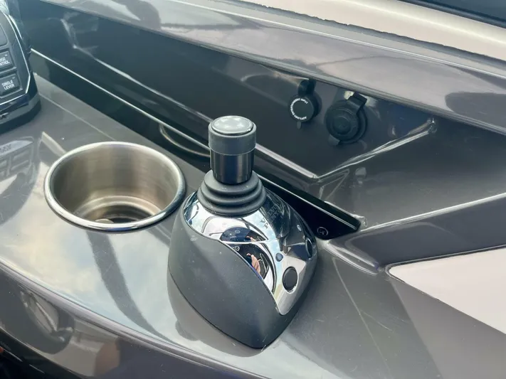  Yacht Photos Pics Joystick control on 2012 Monterey 328 SS boat dashboard with cup holder.