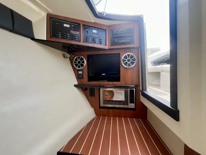  Yacht Photos Pics Interior of 2012 Monterey 328 SS boat with control panel and entertainment system.