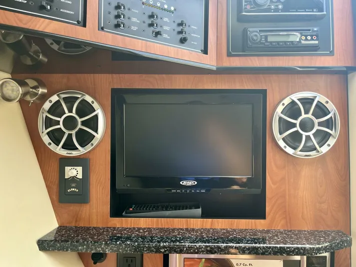  Yacht Photos Pics Entertainment system in a 2012 Monterey 328 SS boat with speakers and a TV.