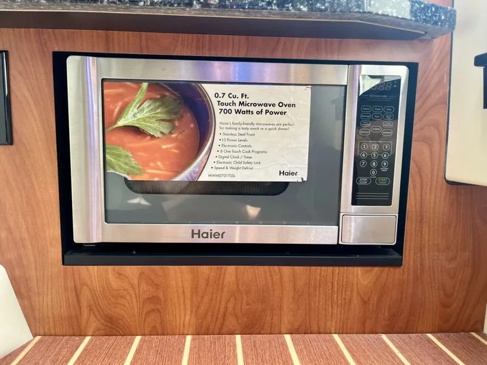  Yacht Photos Pics Built-in Haier microwave in 2012 Monterey 328 SS boat kitchen.