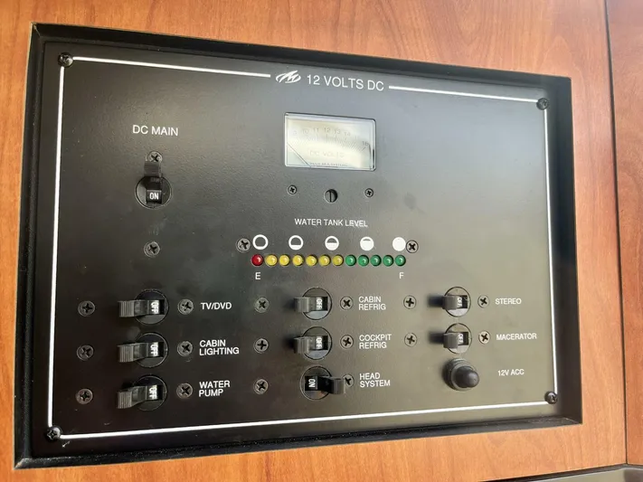  Yacht Photos Pics Control panel of a 2012 Monterey 328 SS boat, featuring various switches and indicators.
