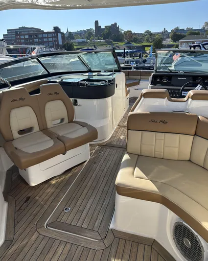  Yacht Photos Pics 2014 Sea Ray 350 SLX boat interior with tan seating and wood flooring.