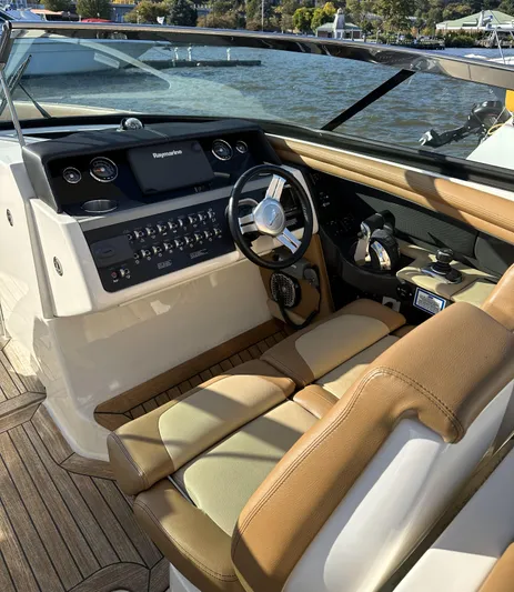  Yacht Photos Pics 2014 Sea Ray 350 SLX boat interior with tan leather seats and modern dashboard.