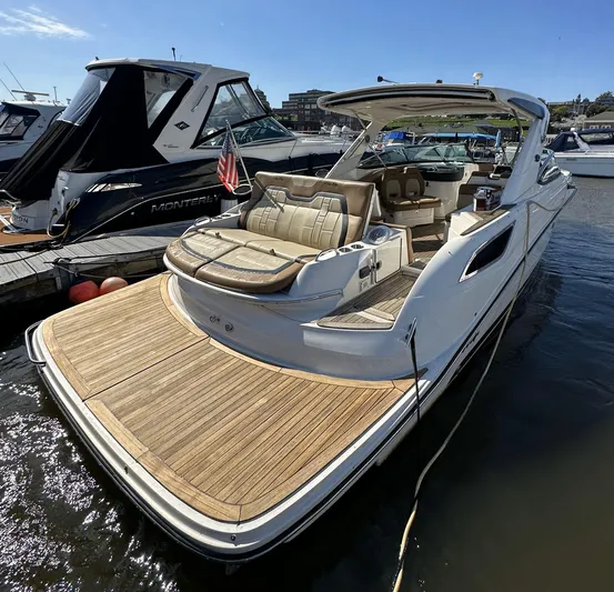  Yacht Photos Pics 2014 Sea Ray 350 SLX luxury boat docked, featuring spacious deck and elegant seating.