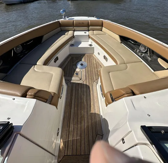  Yacht Photos Pics 2014 Sea Ray 350 SLX boat interior with tan seating and wooden deck.