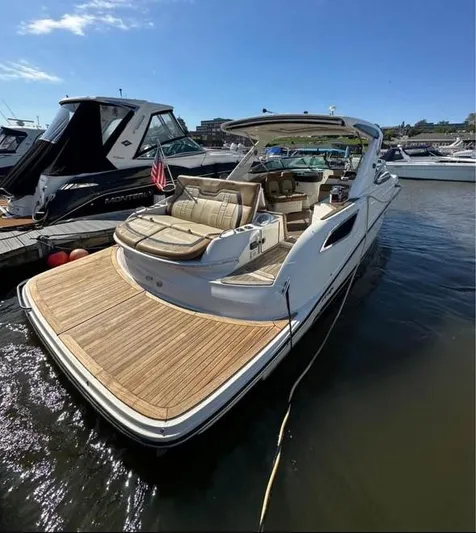  Yacht Photos Pics 2014 Sea Ray 350 SLX luxury boat docked, featuring spacious seating and sleek design.