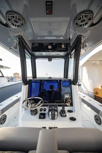  Yacht Photos Pics 2024 Freeman 28 boat cockpit with modern controls and navigation system.