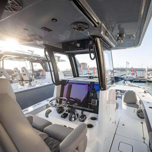  Yacht Photos Pics 2024 Freeman 28 boat interior with modern helm, docked at marina.