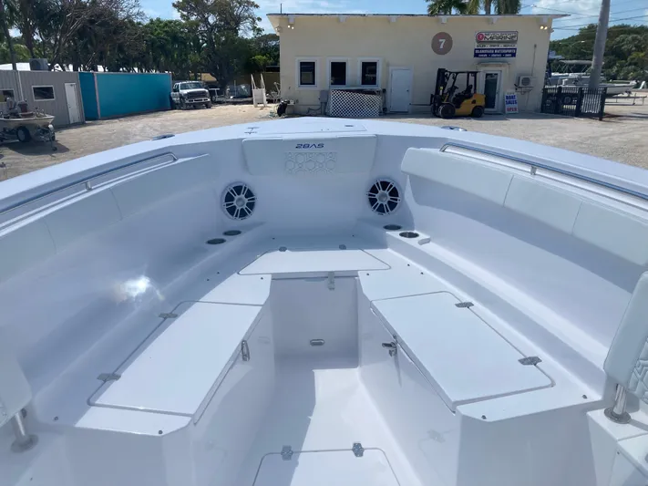  Yacht Photos Pics 2025 Aquasport 28AS boat interior with spacious seating and storage compartments.