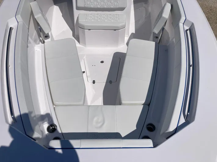  Yacht Photos Pics 2025 Aquasport 28AS boat interior with white seating and sleek design.