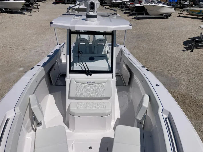  Yacht Photos Pics 2025 Aquasport 28AS boat, sleek design, spacious seating, modern features, docked outdoors.