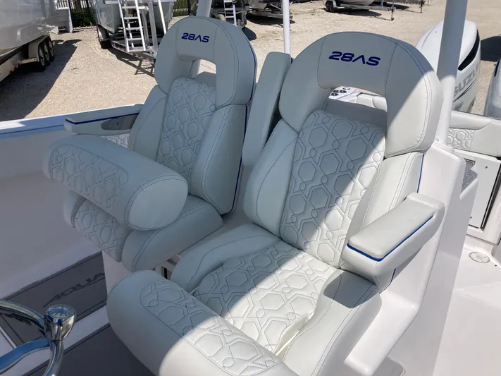  Yacht Photos Pics Luxury seating on 2025 Aquasport 28AS boat, featuring plush white upholstery.