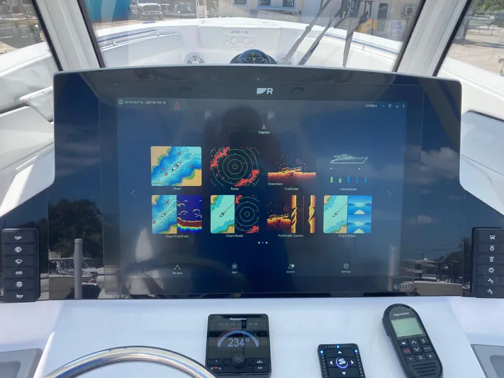  Yacht Photos Pics Dashboard of 2025 Aquasport 28AS boat with advanced navigation display.
