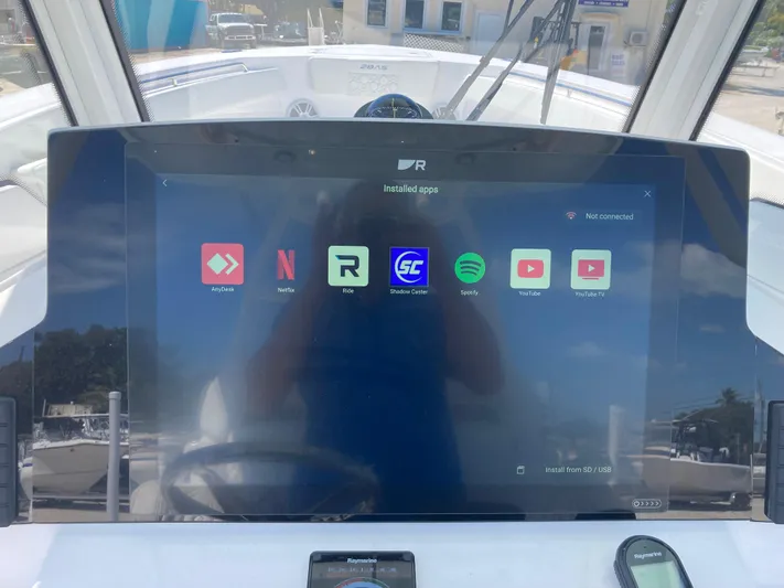  Yacht Photos Pics Dashboard of 2025 Aquasport 28AS boat with entertainment apps displayed.