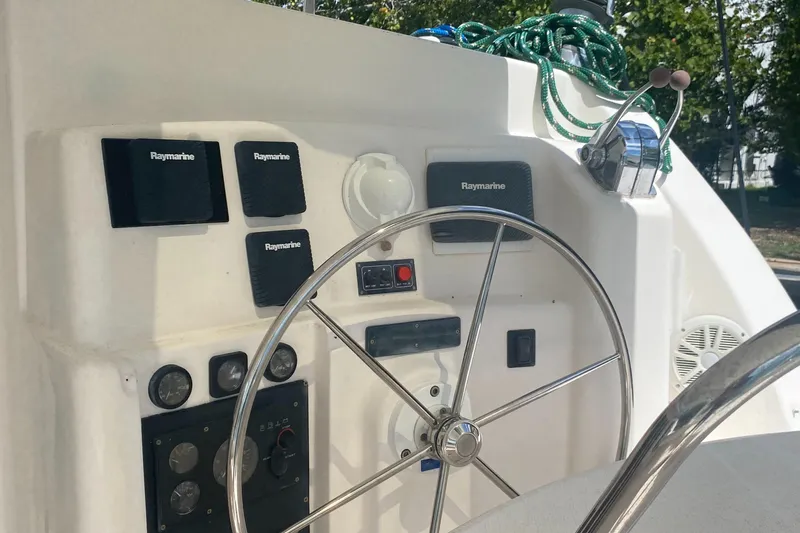 Tiki Yacht Photos Pics Steering wheel and control panel of a 2003 Leopard 38 catamaran.