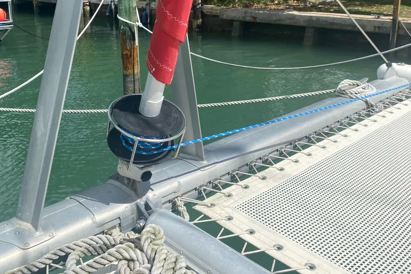 Tiki Yacht Photos Pics Catamaran deck detail, Leopard 38, 2003 model, featuring rigging and netting over water.