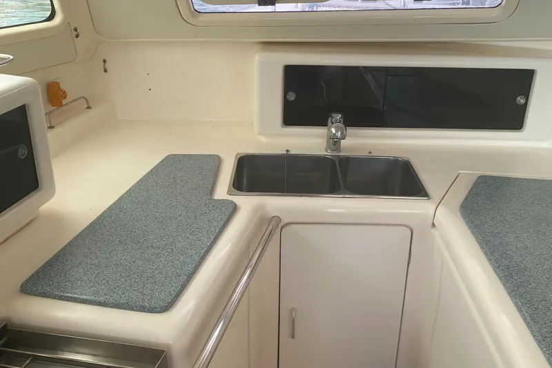 Tiki Yacht Photos Pics 2003 Leopard 38 yacht kitchen with dual sinks and spacious countertops.