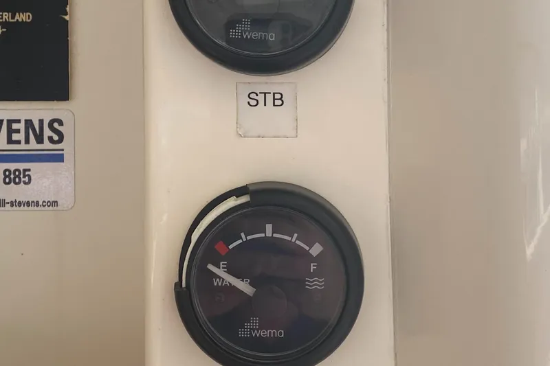 Tiki Yacht Photos Pics Fuel gauge panel on a 2003 Leopard 38 boat, showing "STB" and "Wema" branding.