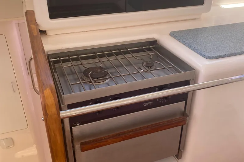 Tiki Yacht Photos Pics Compact kitchen stove in a 2003 Leopard 38 yacht galley.