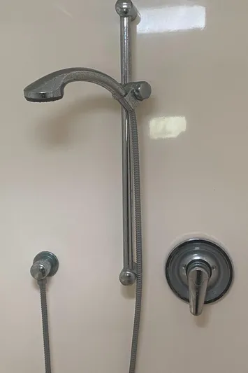 Tiki Yacht Photos Pics Shower fixture in a 2003 Leopard 38 yacht bathroom.