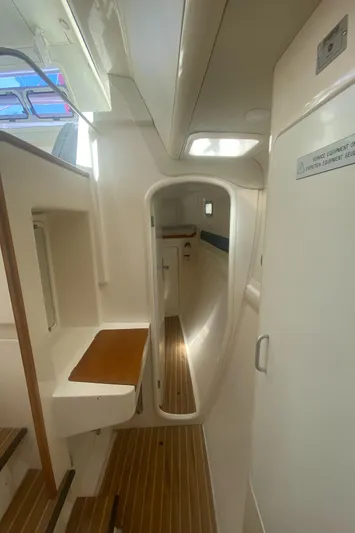 Tiki Yacht Photos Pics Interior of a 2003 Leopard 38 catamaran, featuring sleek design and wooden flooring.