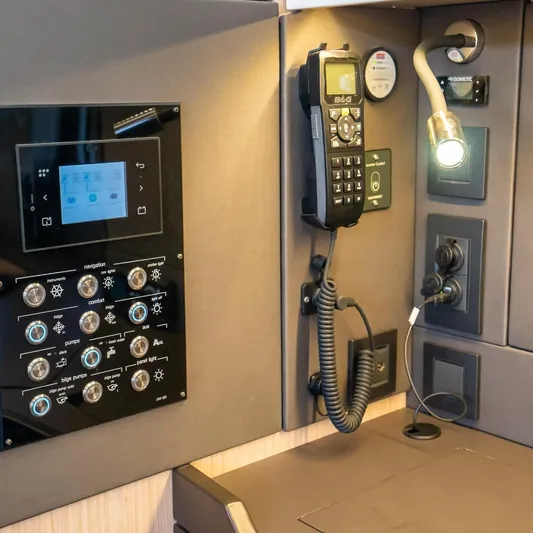 Gwint Yacht Photos Pics Control panel of 2019 Beneteau Oceanis Yacht 62 with navigation and communication equipment.