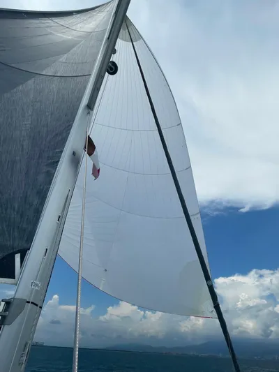 Gwint Yacht Photos Pics Sailing on a 2019 Beneteau Oceanis Yacht 62 under clear skies.