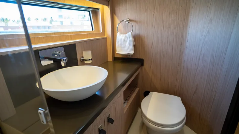 Gwint Yacht Photos Pics Luxurious bathroom in 2019 Beneteau Oceanis Yacht 62 with modern sink and toilet.