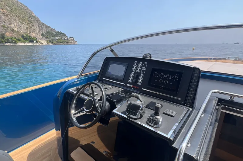  Yacht Photos Pics Cockpit view of 2021 Solaris Power 48 OPEN yacht with scenic ocean backdrop.