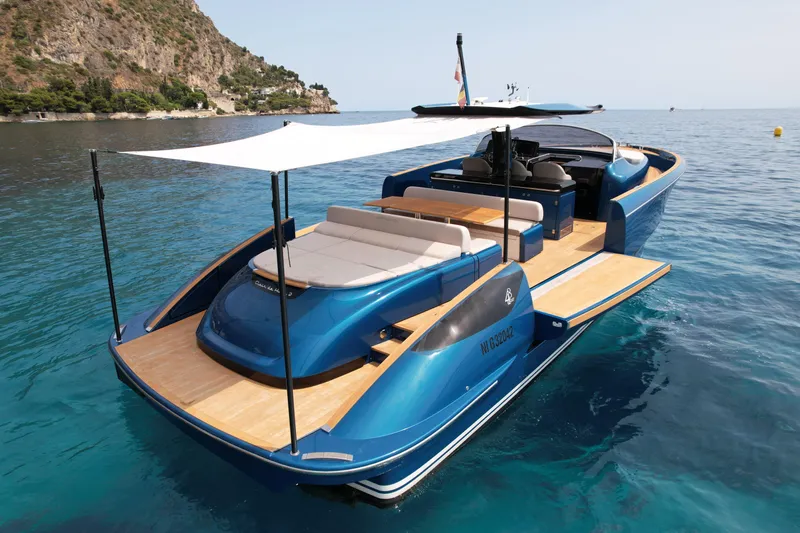  Yacht Photos Pics 2021 Solaris Power 48 OPEN yacht on clear blue water, featuring sleek design and sunshade.