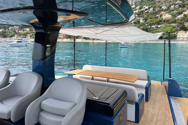  Yacht Photos Pics Luxurious 2021 Solaris Power 48 OPEN yacht interior with elegant seating and scenic ocean view.