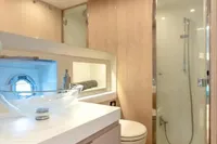Luxurious bathroom in 2021 Solaris Power 48 OPEN yacht with modern fixtures and glass shower.