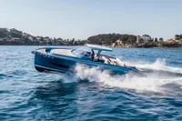 2021 Solaris Power 48 OPEN yacht cruising on blue ocean waters.