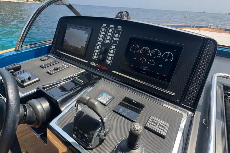  Yacht Photos Pics Control panel of a 2021 Solaris Power 48 OPEN yacht with navigation screens.