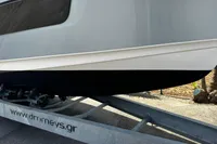 2024 Nimbus T11 X-EDITION boat on trailer, side view, outdoors.