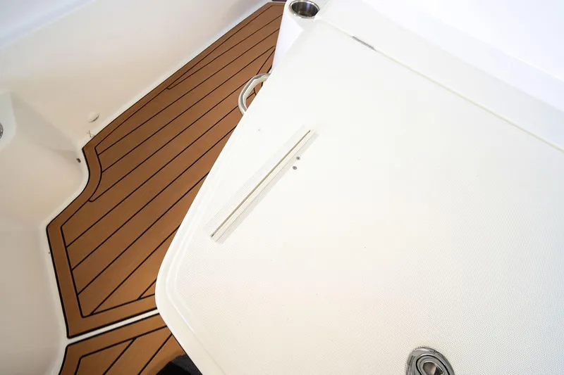 Yacht Photos Pics 2020 Jeanneau Leader 9.0 CC boat deck with teak flooring and white surface.