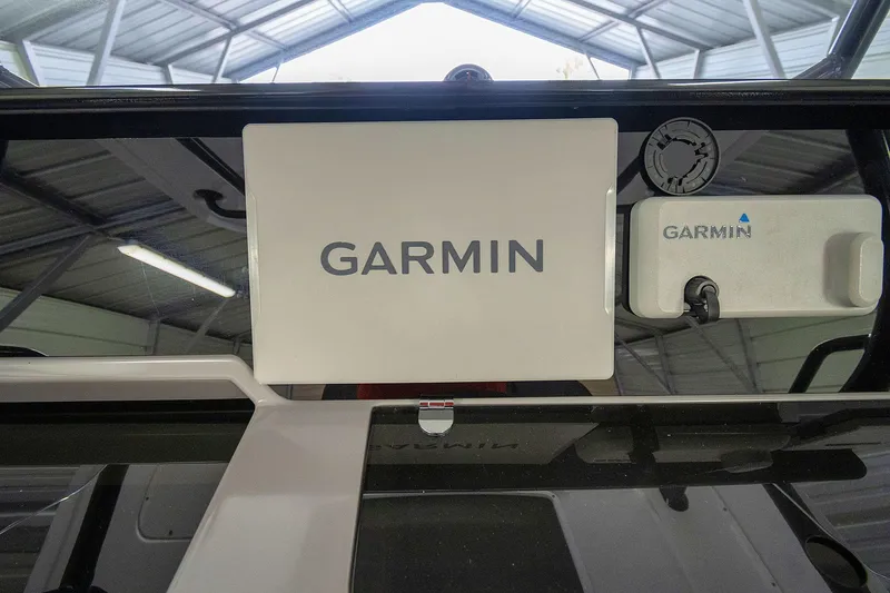  Yacht Photos Pics Garmin equipment on 2020 Jeanneau Leader 9.0 CC boat dashboard in a covered area.