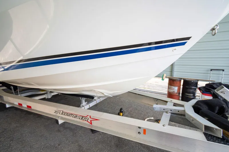  Yacht Photos Pics 2020 Jeanneau Leader 9.0 CC boat on trailer in storage facility.