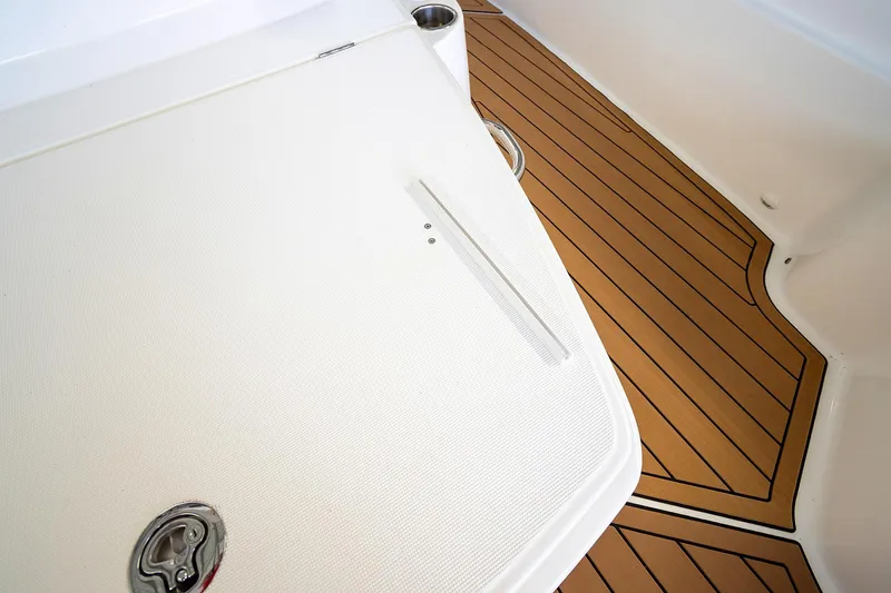  Yacht Photos Pics 2020 Jeanneau Leader 9.0 CC deck with teak flooring and stainless steel fixtures.