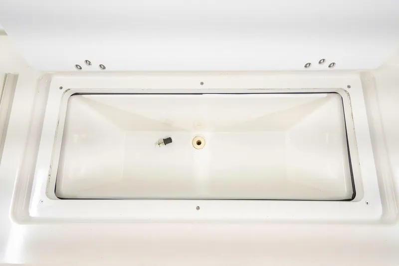  Yacht Photos Pics 2020 Jeanneau Leader 9.0 CC storage compartment, white interior, open lid view.