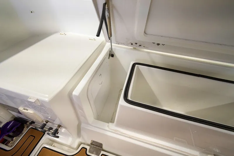  Yacht Photos Pics 2020 Jeanneau Leader 9.0 CC storage compartment with open lid, showcasing interior space.