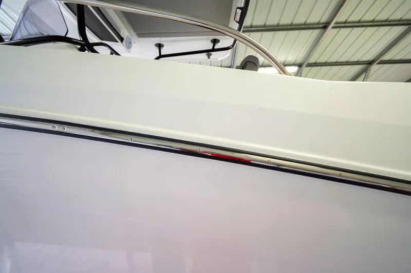  Yacht Photos Pics 2020 Jeanneau Leader 9.0 CC boat side view in a storage facility.